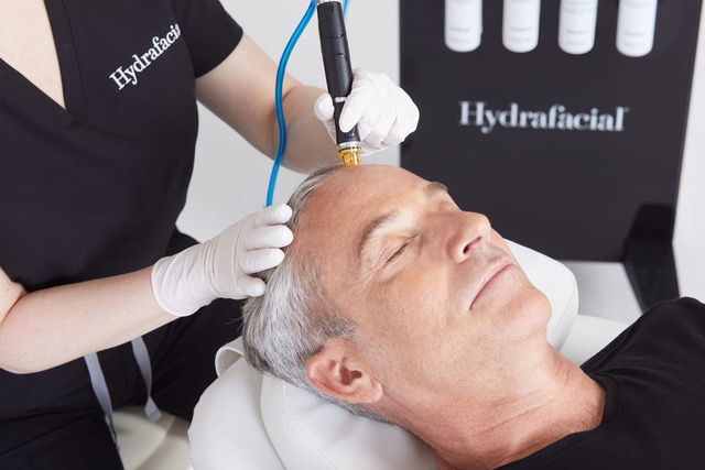 Man receiving Hydrafacial treatment